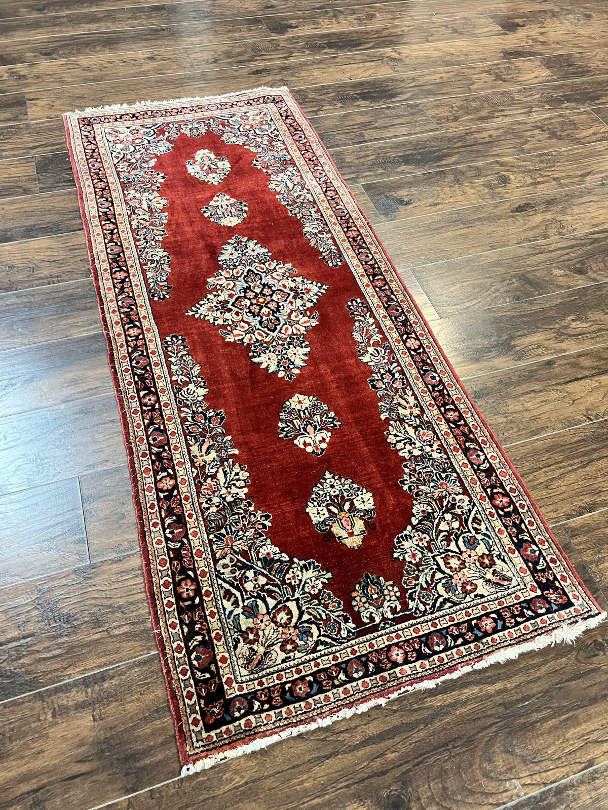 Handmade Persian Sarouk runner rug in red, 2.7 x 6 feet, wool, vintage semi-antique, hand knotted oriental carpet with semi-open field design.