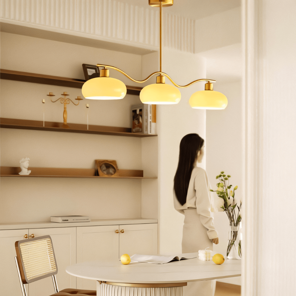 Ampix chandelier by Residence Supply featuring modern design with multiple hanging glass shades and sleek metallic finish.