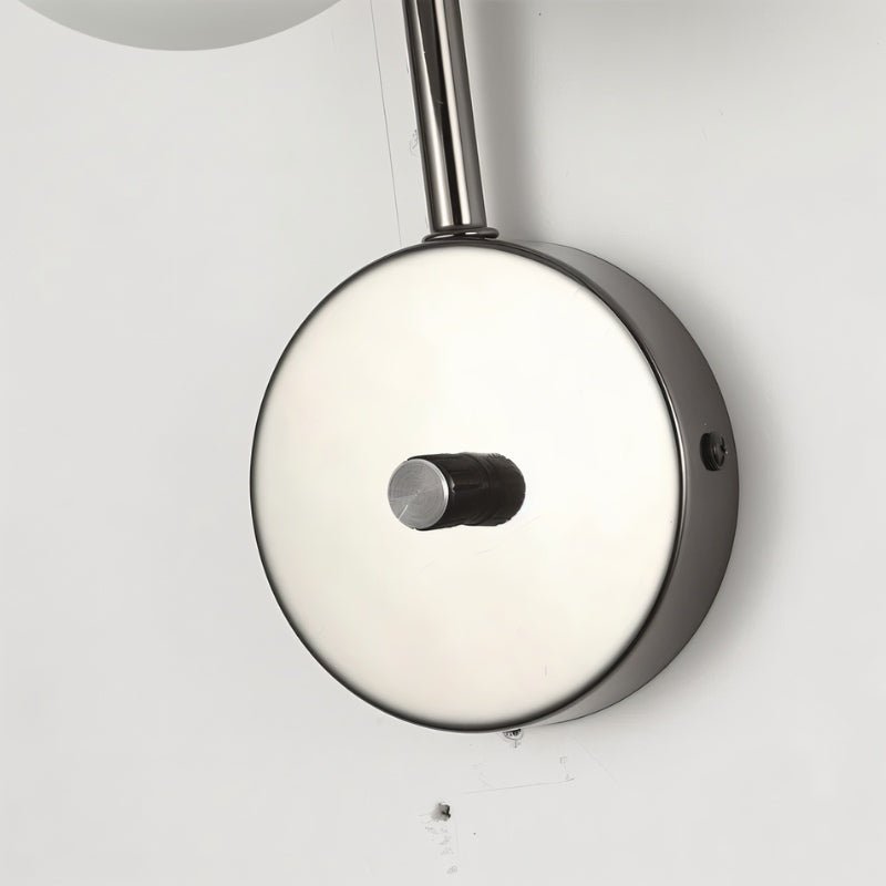 Residence Supply Crickle Wall Lamp mounted on a wall with a sleek design and warm lighting in a modern interior setting.