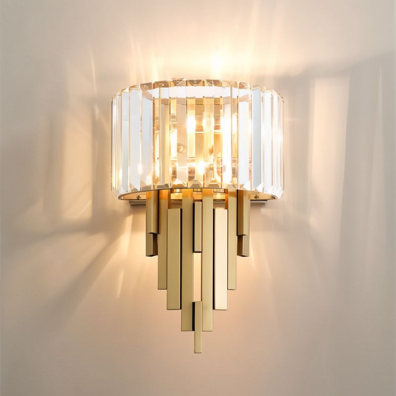 Eudora Wall Lamp by Residence Supply featuring a sleek design with a white shade and brass finish, mounted on a wall.