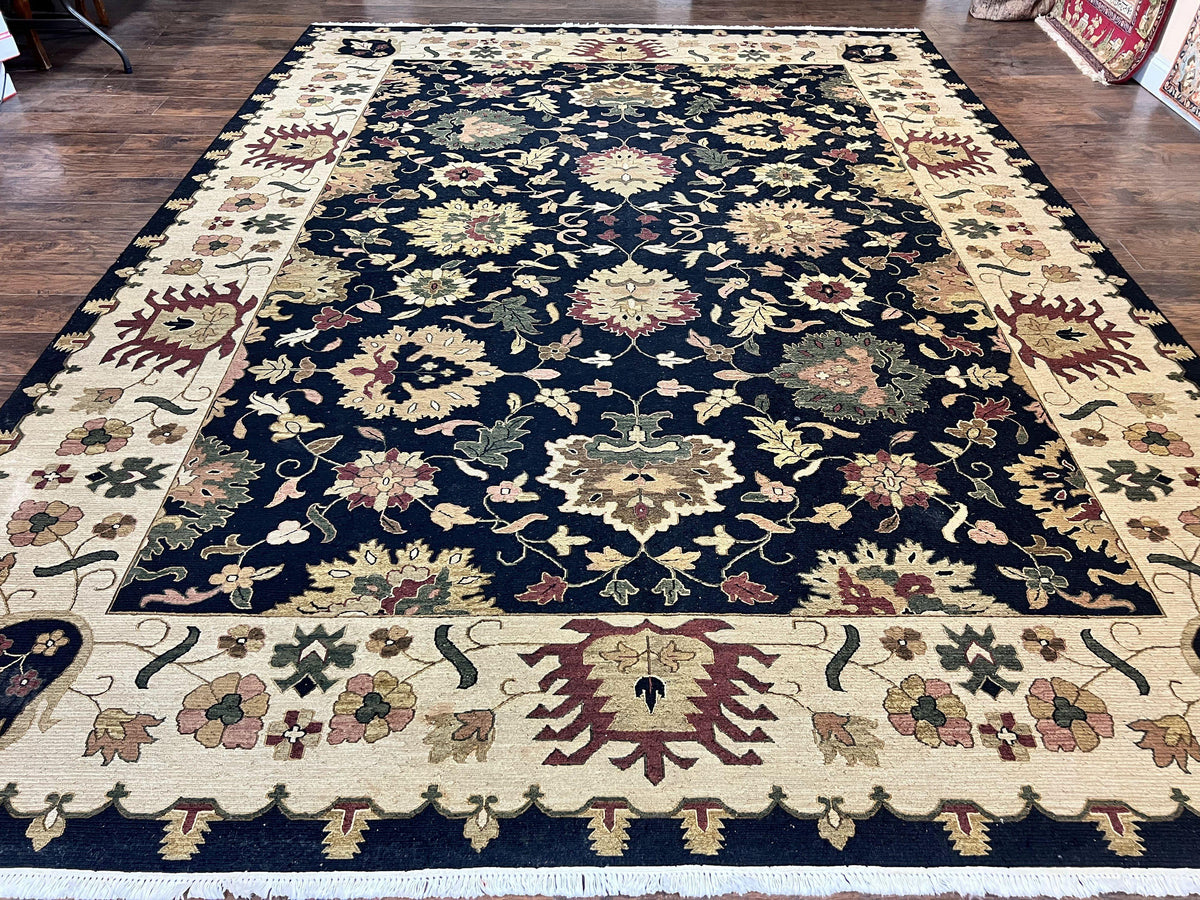 Handmade Indo Persian Wool rug, 10x14 floral Oriental carpet in black and beige, with intricate traditional Mahal design.