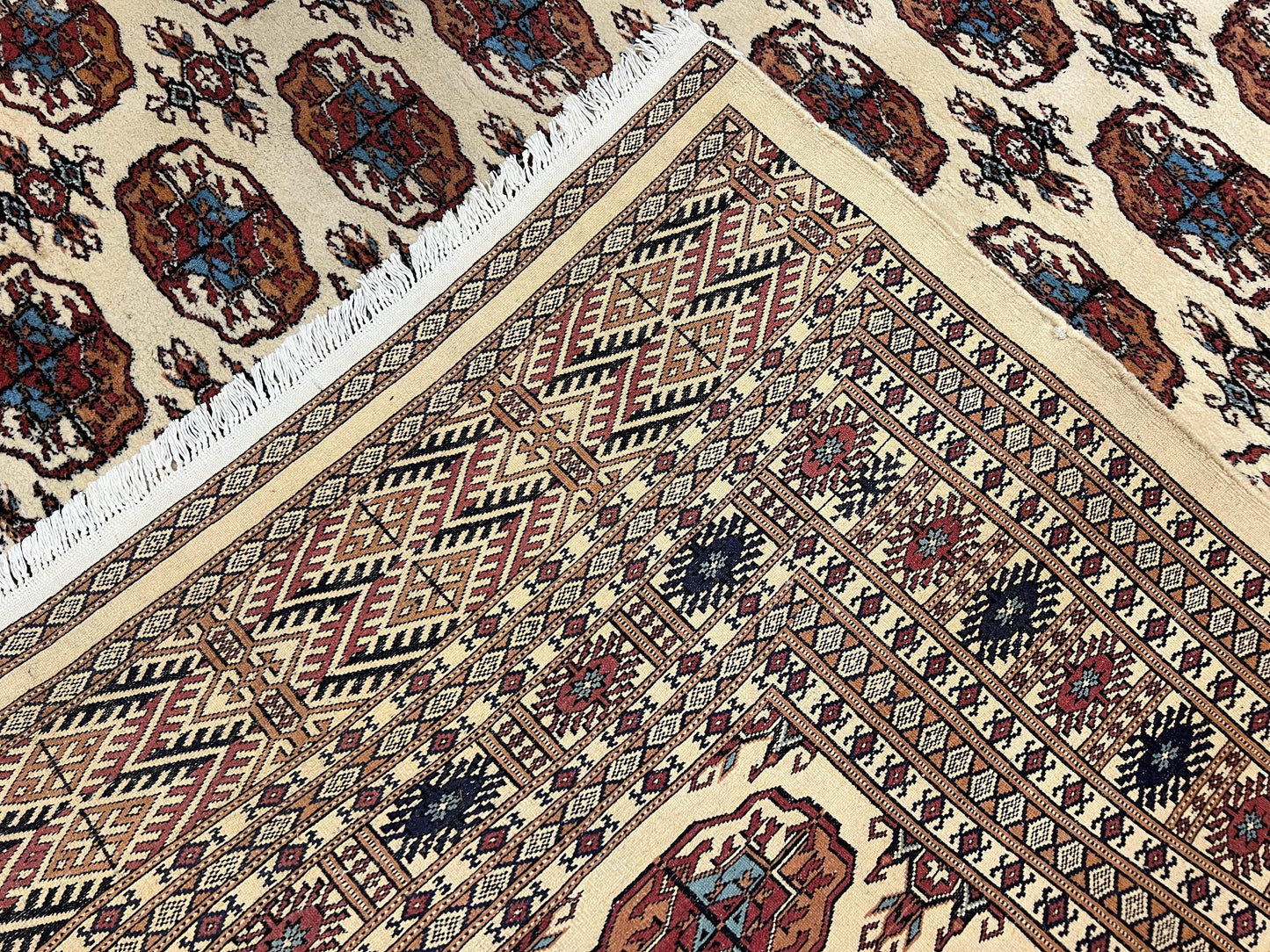 Pakistani Bokhara Rug 8x10, Traditional Turkoman Tribal Carpet, Allover Repeated Elephant Foot Motif, Ivory/Cream Black Red, Vintage Handmade - Nuvé