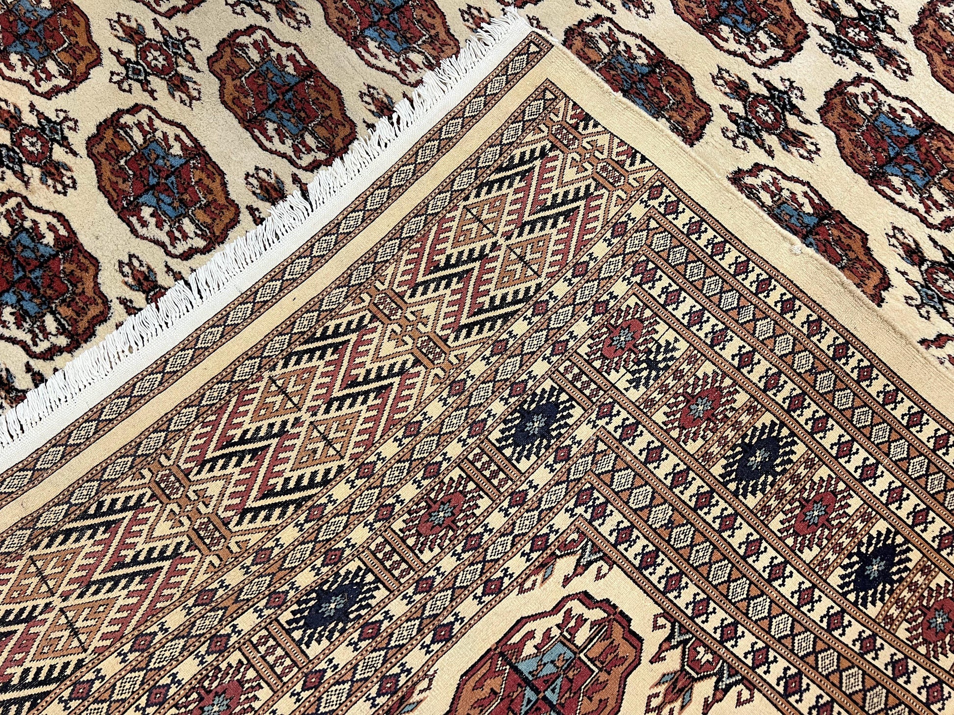 Pakistani Bokhara Rug 8x10, Traditional Turkoman Tribal Carpet, Allover Repeated Elephant Foot Motif, Ivory/Cream Black Red, Vintage Handmade - Nuvé