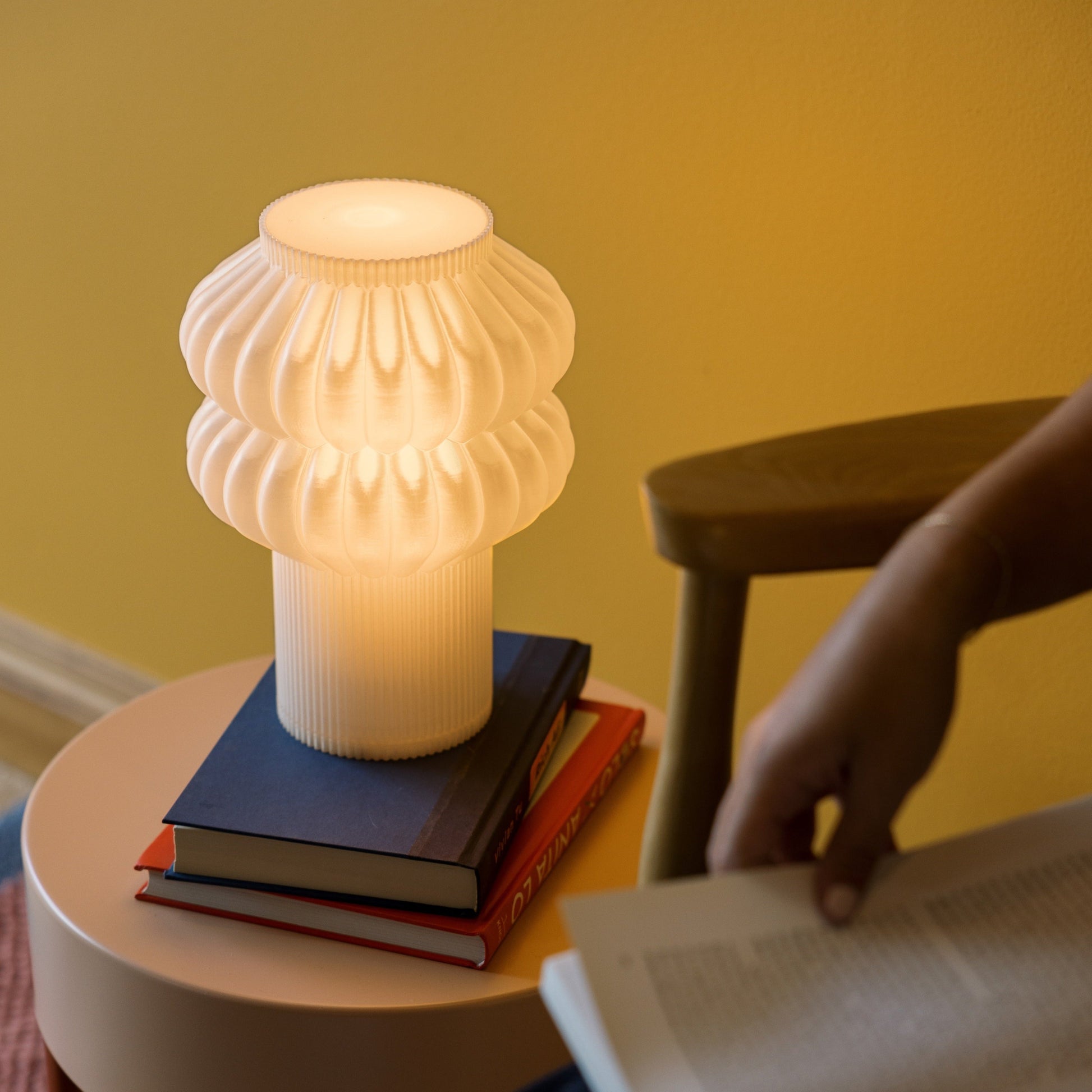 Terra Labs Oppi Table Lamp with a sleek, modern design featuring a white ceramic base and a fabric lampshade.