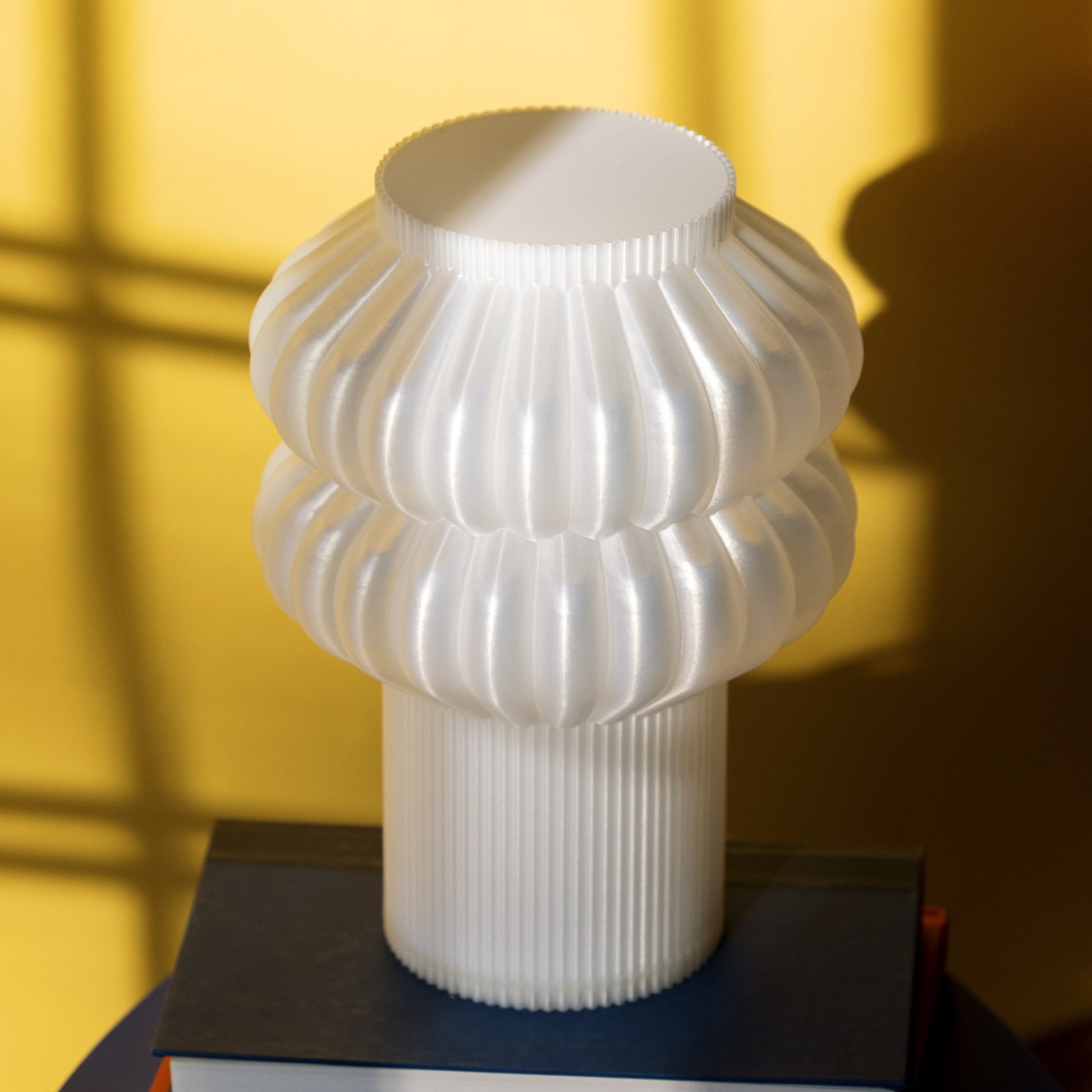 Terrra Labs Oppi table lamp with a sleek modern design, featuring a cylindrical base and a soft fabric lampshade.