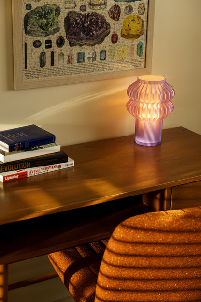 Oppi Table Lamp by Terra Labs featuring a modern design with a sleek base and soft glowing light.