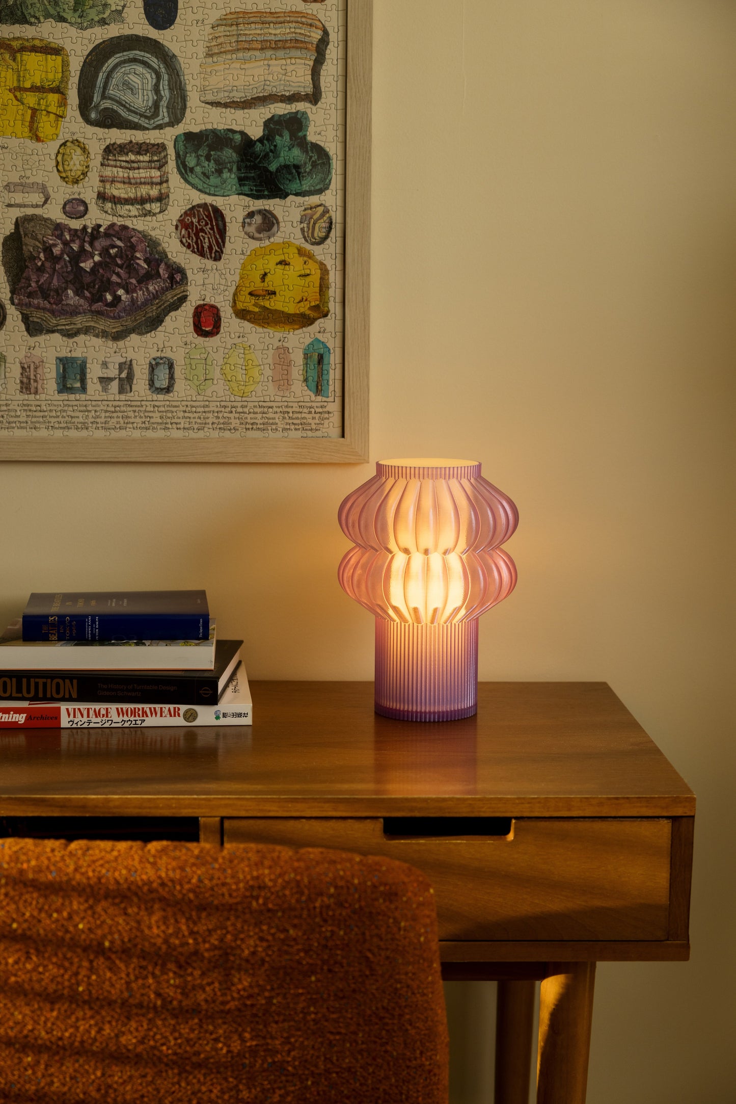 Terra Labs Oppi Table Lamp with a sleek modern design and soft lighting, placed on a wooden side table.