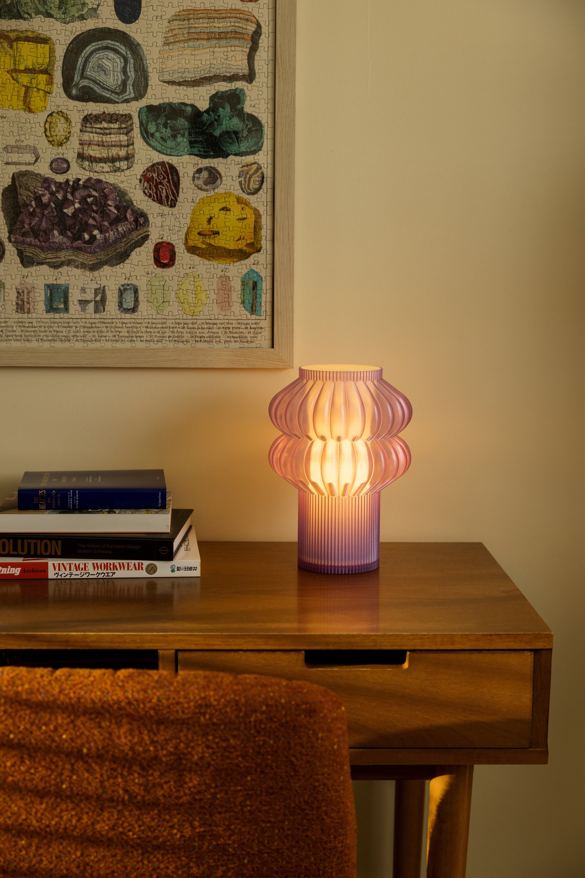 Terra Labs Oppi Table Lamp with a sleek modern design and soft lighting, placed on a wooden side table.