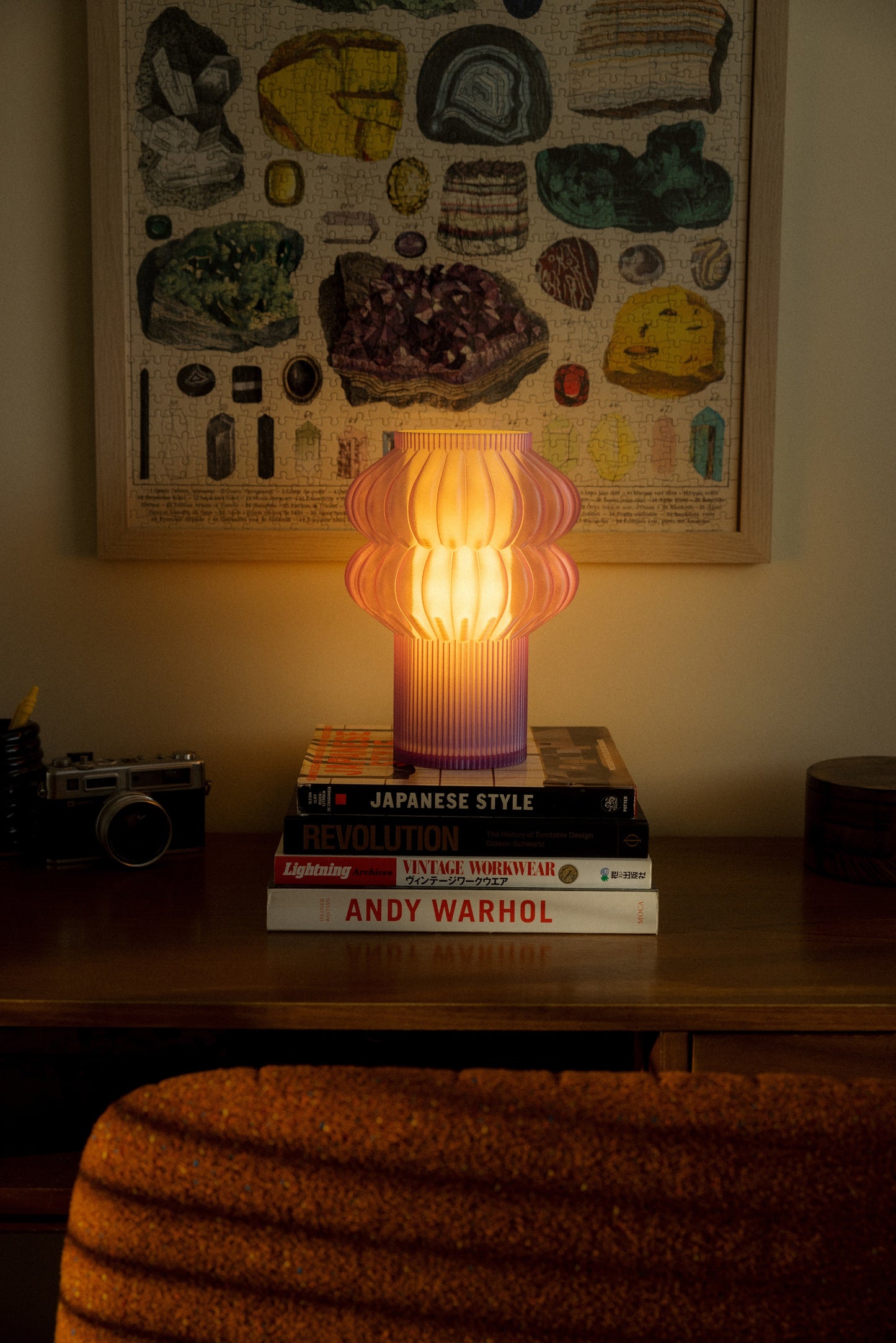 Terrra Labs Oppi table lamp with a modern design, featuring a sleek base and soft fabric shade on a wooden table.