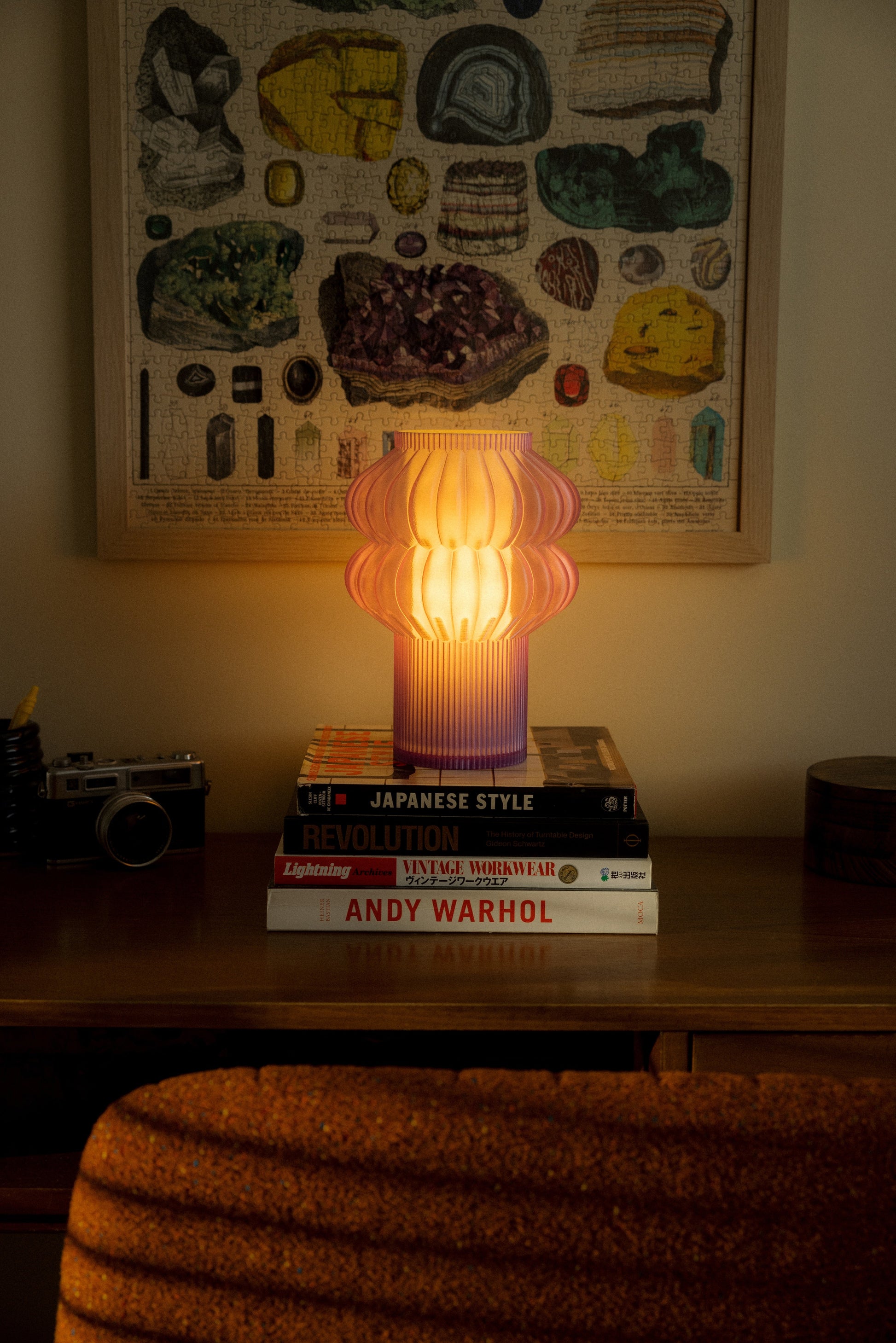 Terrra Labs Oppi table lamp with a modern design, featuring a sleek base and soft fabric shade on a wooden table.
