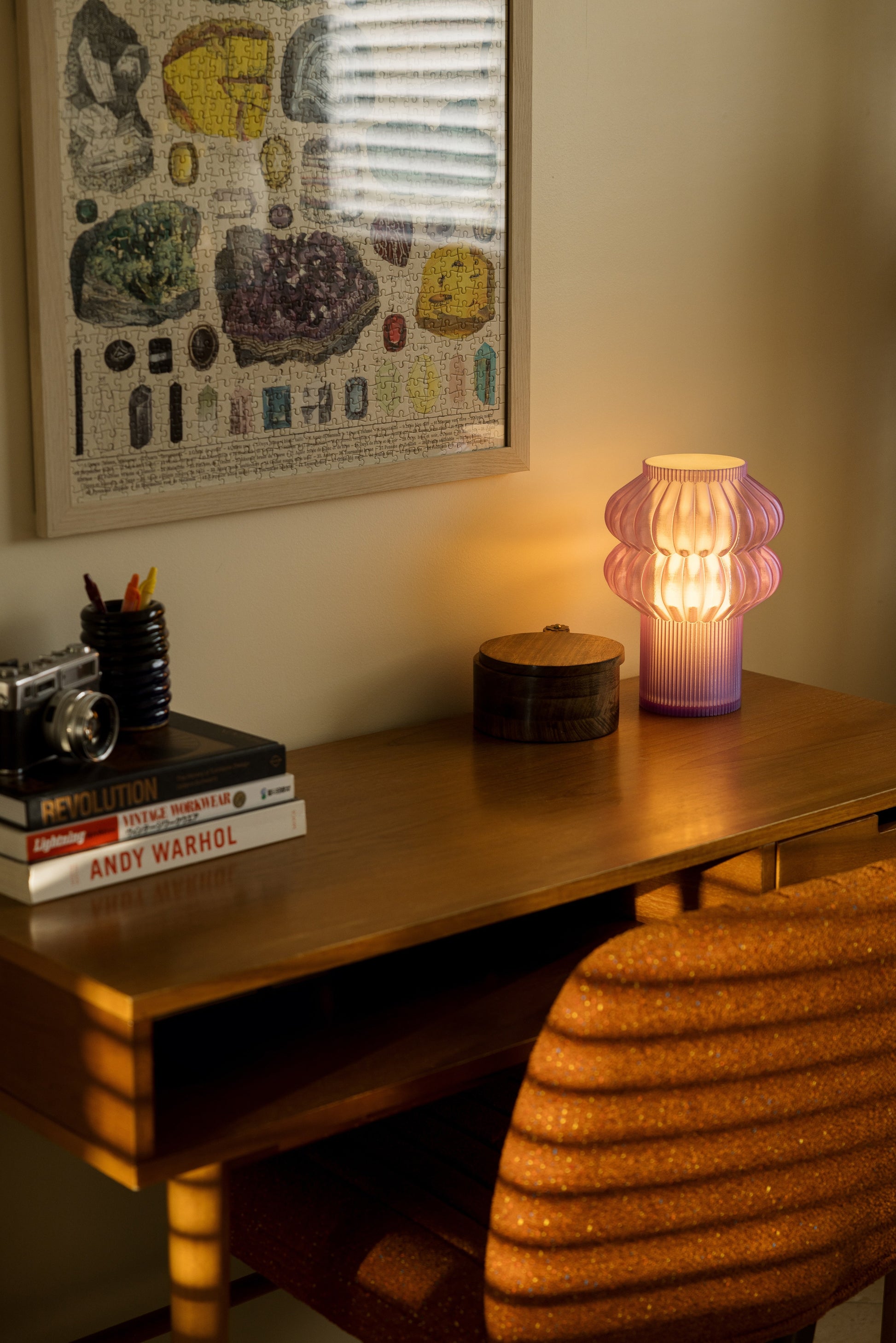 Terra Labs Oppi table lamp with a sleek, modern design and a soft glowing light, perfect for home or office decor.