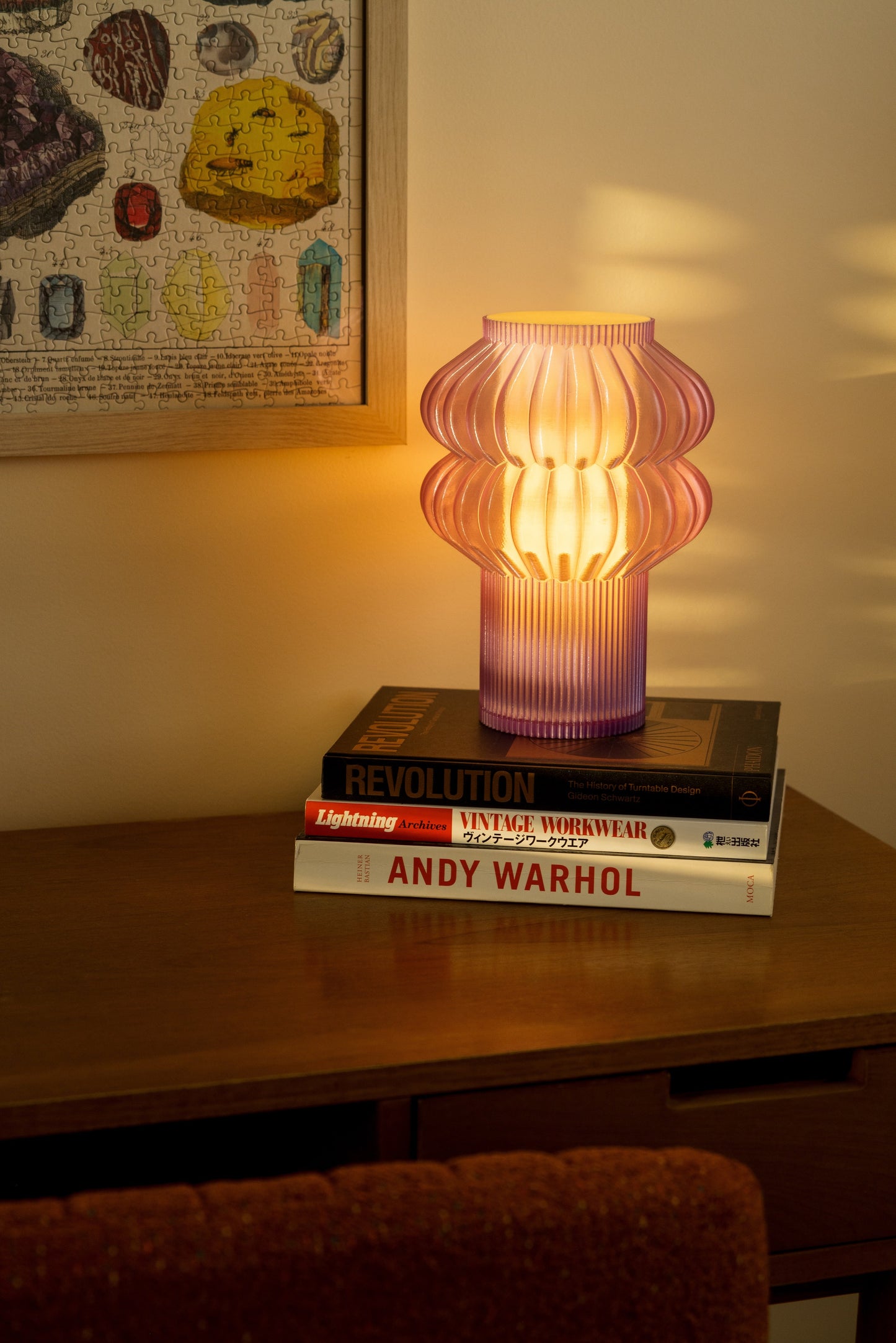 Terra Labs Oppi Table Lamp with a sleek modern design, featuring a cylindrical base and a soft glowing light.