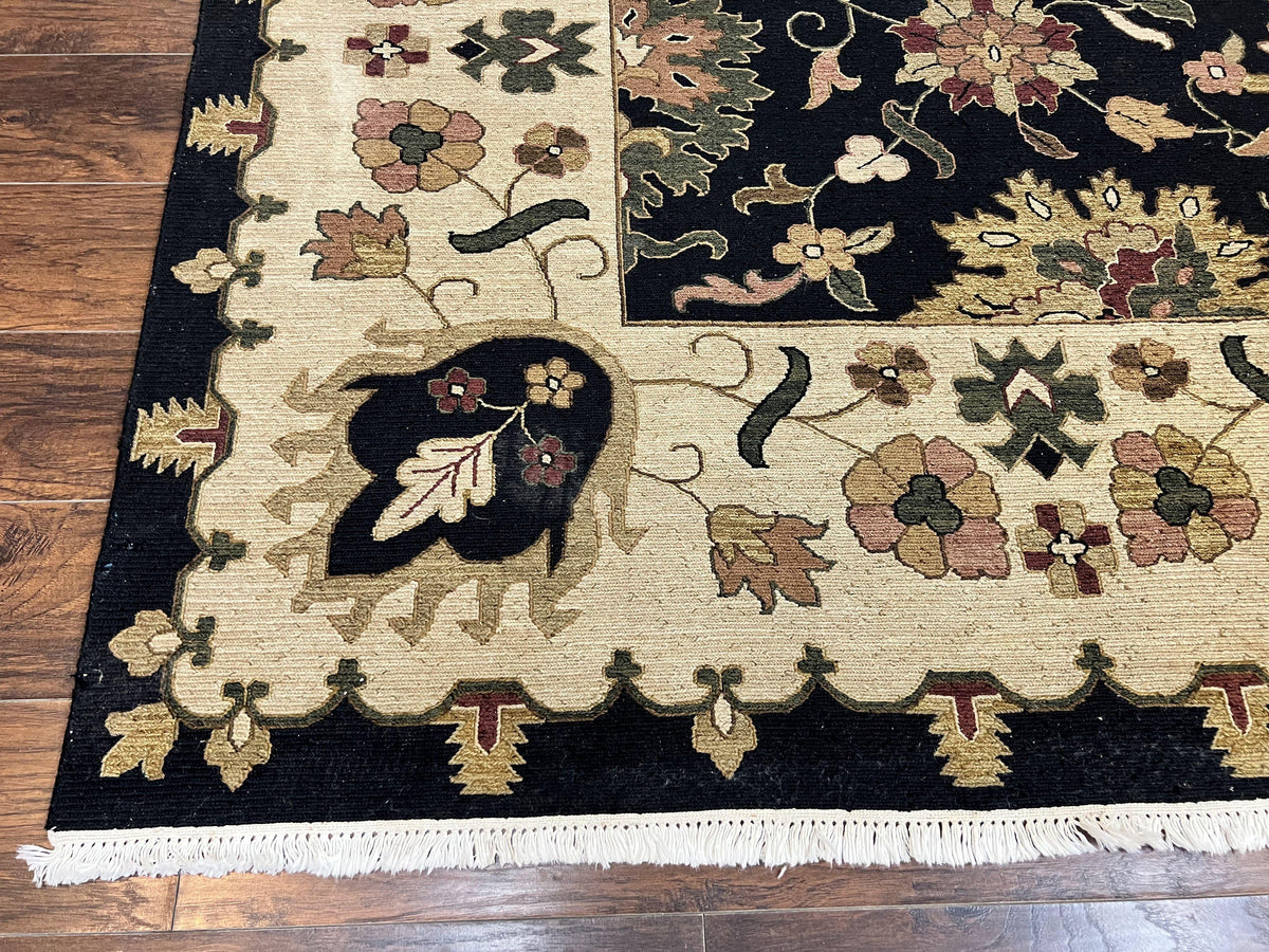 Handmade Indo Persian wool floral rug in black and beige, 10x14 size with intricate oriental design by Jewel Rugs.