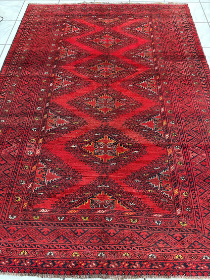 Hand-Knotted Afghan Turkoman Waziri Wool Rug – 6'9" x 9'6" – Vintage Red Elegance - Nuvé