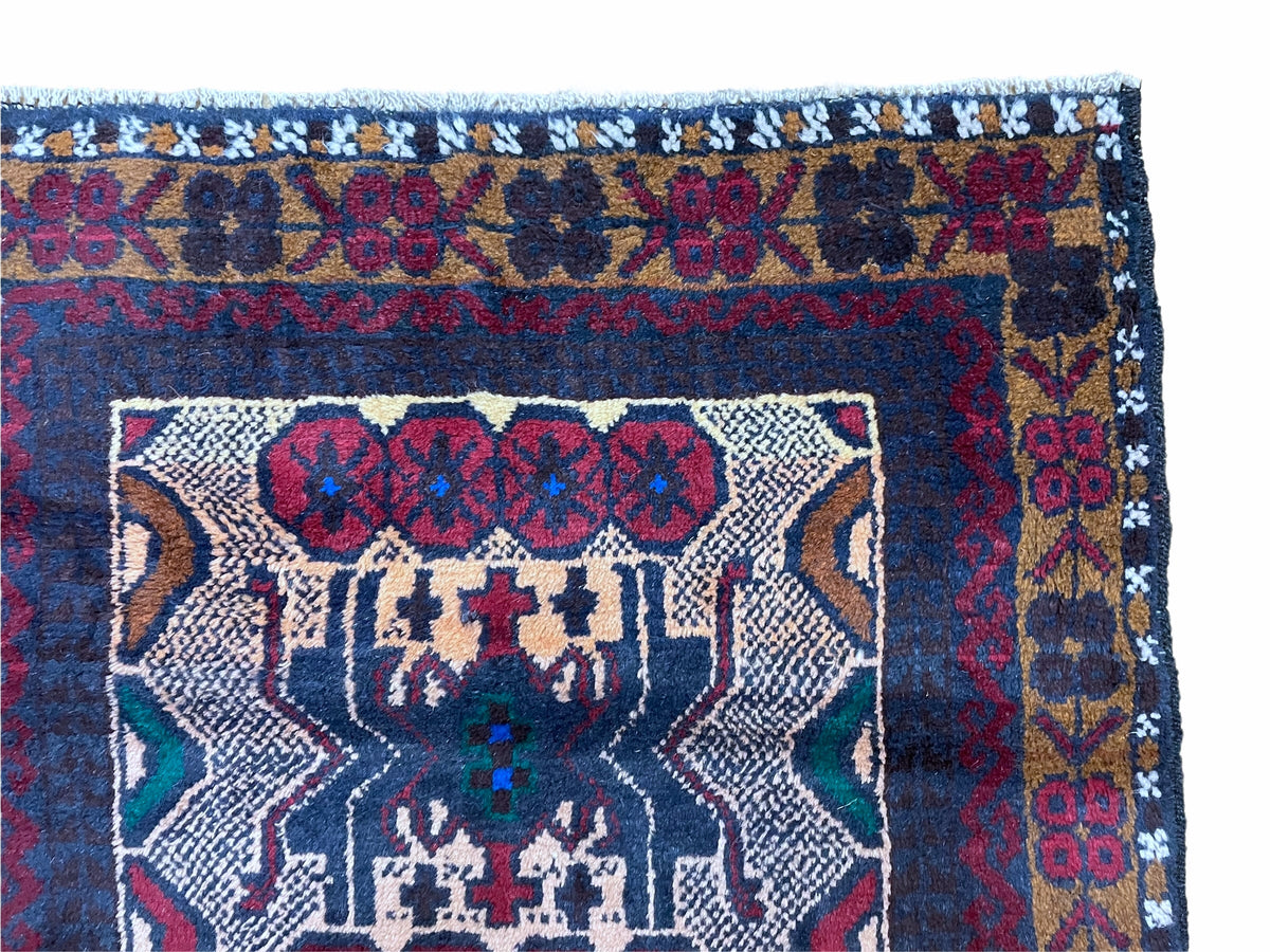 Handmade 3x5 tribal wool rug with red and beige Balouchi Afghan design, crafted by Jewel Rugs.