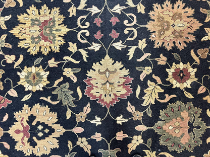 Handmade Indo Persian wool rug featuring floral oriental design in black and beige, 10x14 size, by Jewel Rugs.