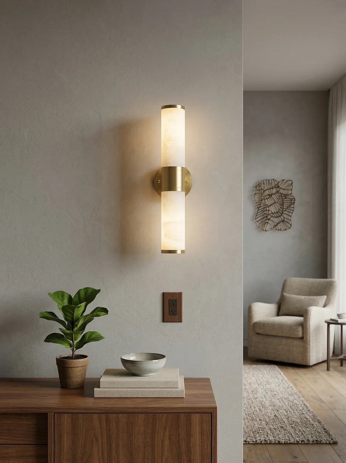 Alabaster Lampatron cylindrical wall lamp by korewolamp, showcasing a sleek white alabaster fixture on a wall.