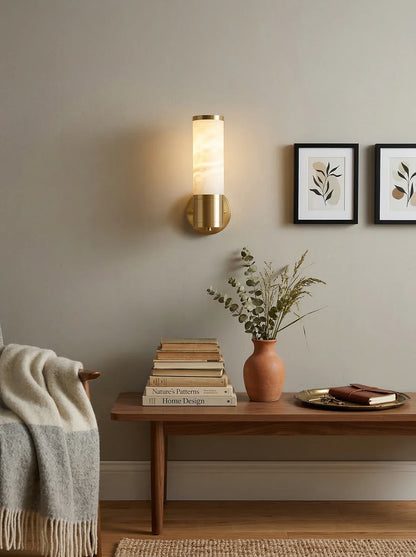 Alabaster Lampatron cylindrical wall lamp by korewolamp mounted on a wall, showcasing its smooth alabaster finish and modern design.