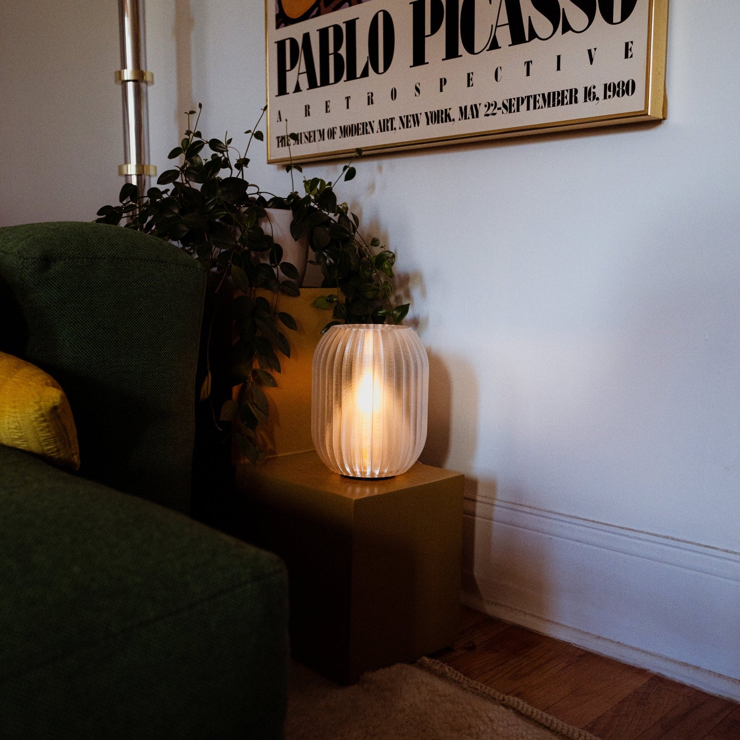 Allium Lamp by Wooj Design featuring a clear glass bulb with a sleek, modern design and a warm lighting effect.