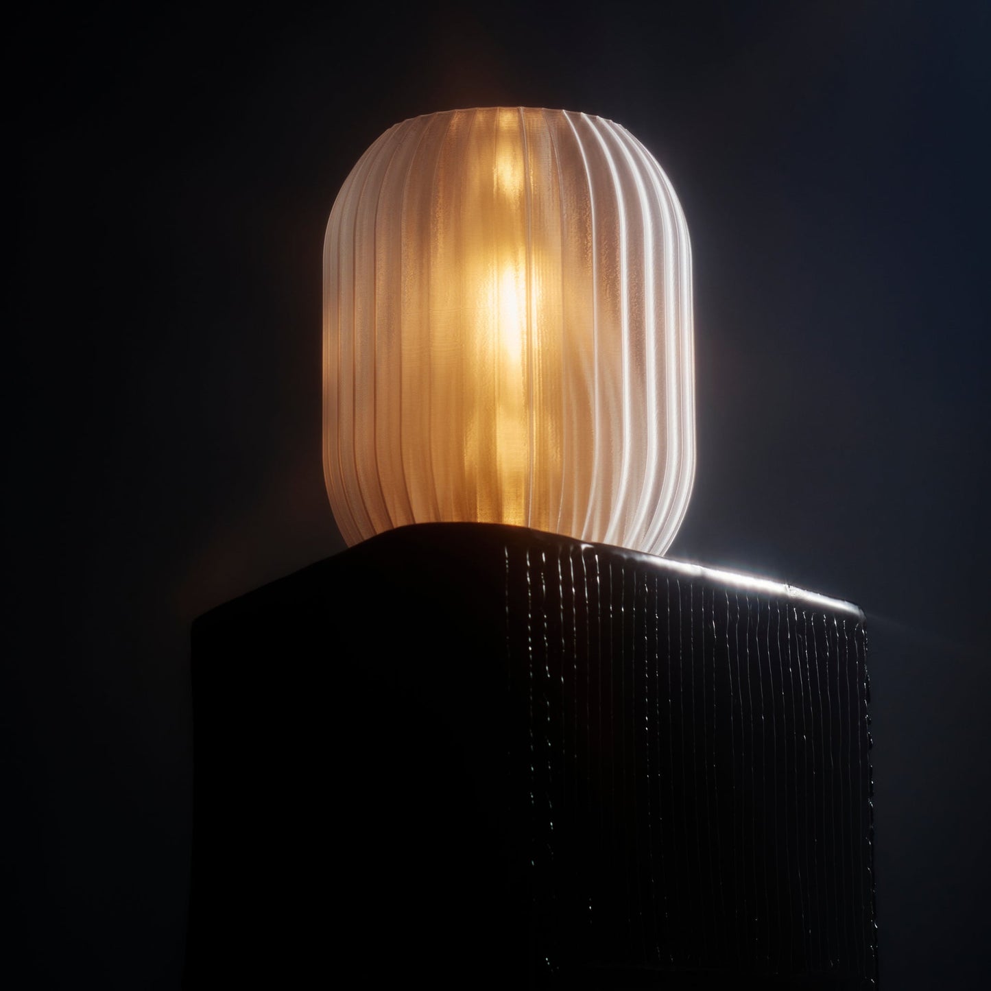 Wooj Design Allium Lamp with clear glass shade and modern floral-inspired design displayed on a surface.