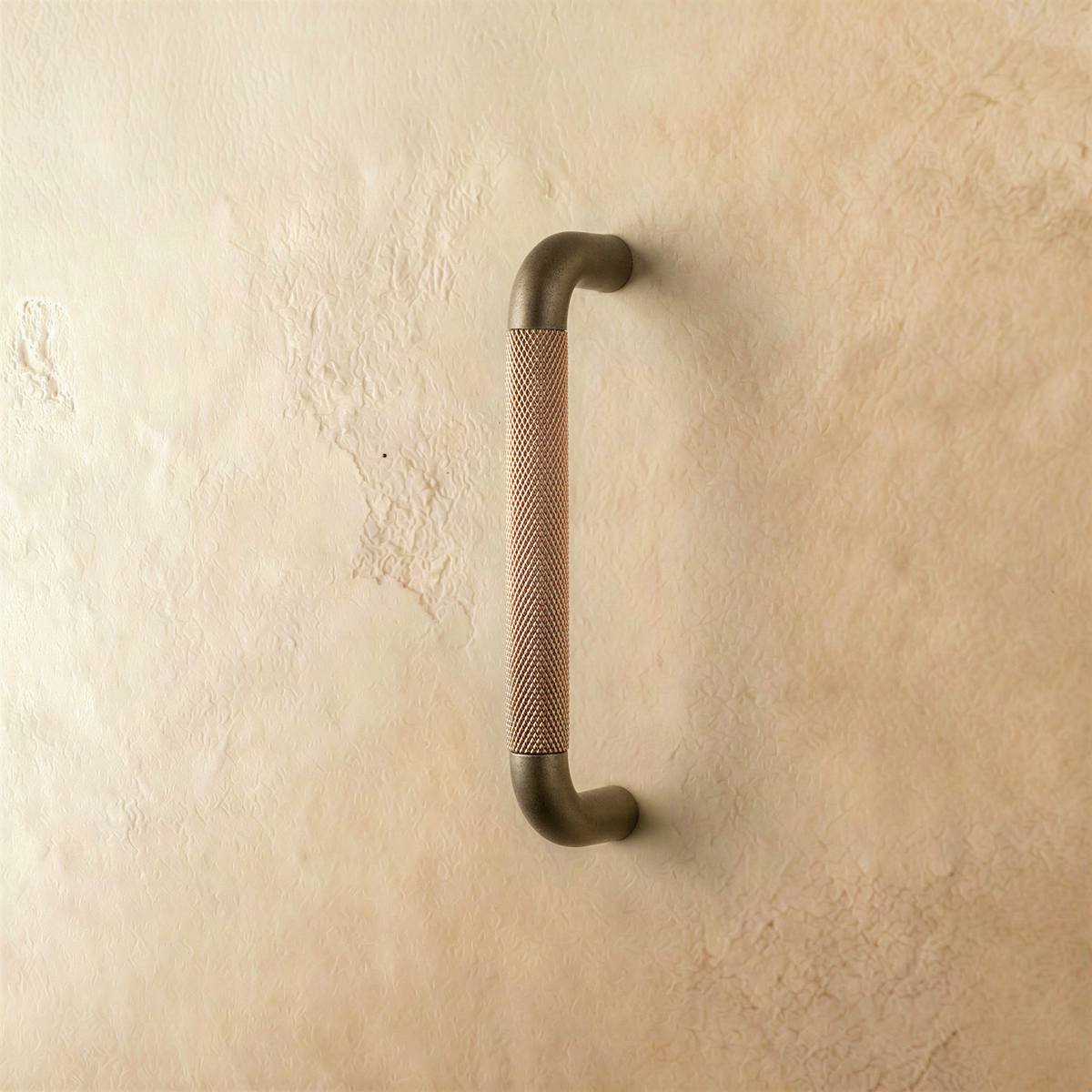 A brown Alyma knob and pull bar from Residence Supply, featuring a sleek design for cabinet hardware in home and garden.