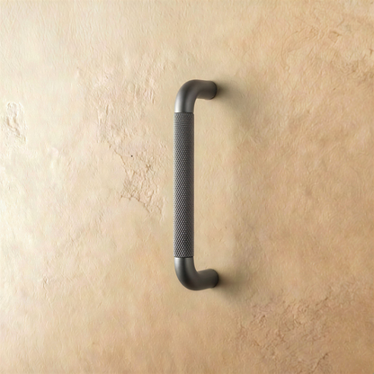 Gray Alyma knob and pull bar from Residence Supply, modern cabinet hardware for kitchen or bathroom cabinets.