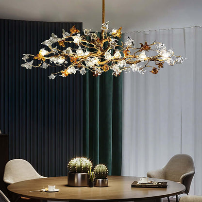 Aosta brass glass branch chandelier by korewolamp with multiple glass flower-shaped lights and brass accents.