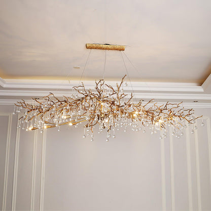 Korewolamp Bijou Crystal Drop Chandelier featuring a tree branch design with sparkling crystal drops and elegant metal details.