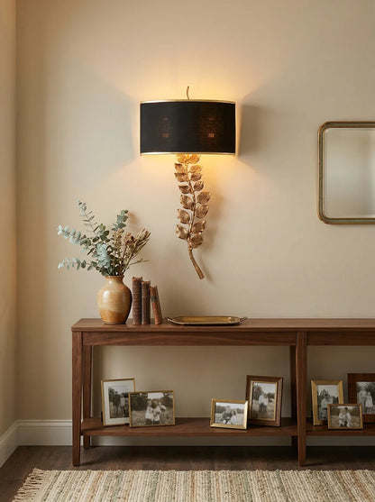 Korewolamp Birdwood wall lamp with sleek metal finish and adjustable arm, mounted on a wall for modern lighting.
