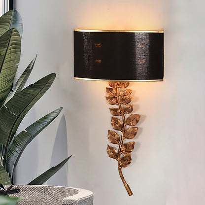 Korewolamp Birdwood wall lamp sconce with modern design and brass finish, mounted on a white wall for ambient lighting.