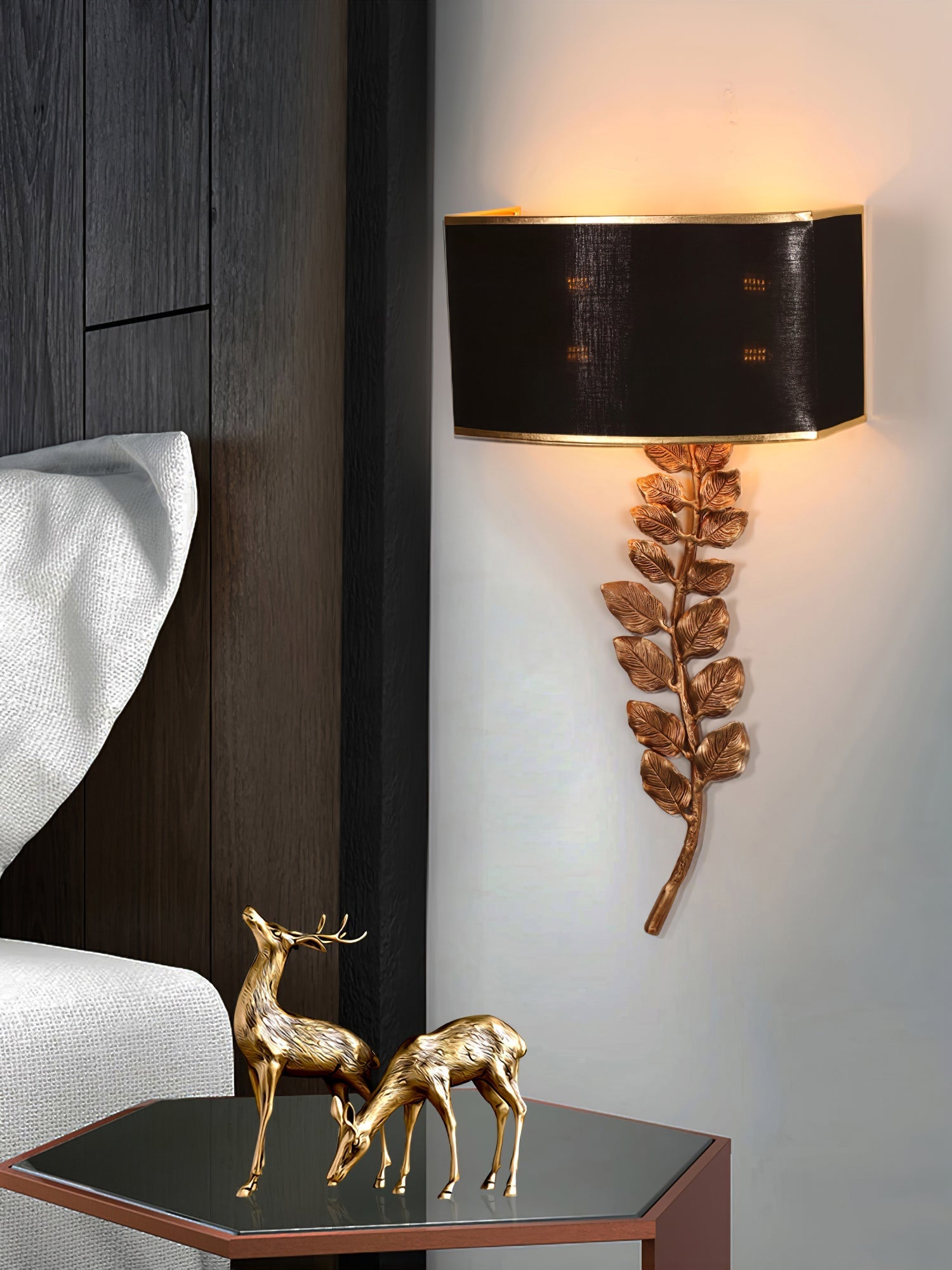 Korewolamp Birdwood wall lamp mounted on a wall, featuring a sleek, modern design with a curved arm and cylindrical shade.