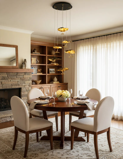 Brass aviary constellation chandelier by korewolamp featuring intricate bird-shaped metal design and warm lighting details