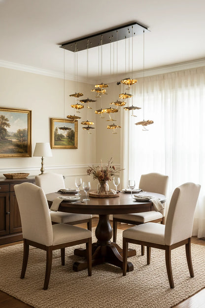 Brass aviary constellation chandelier with star-shaped light fixtures, designed by korewolamp, hanging with a modern, artistic style.