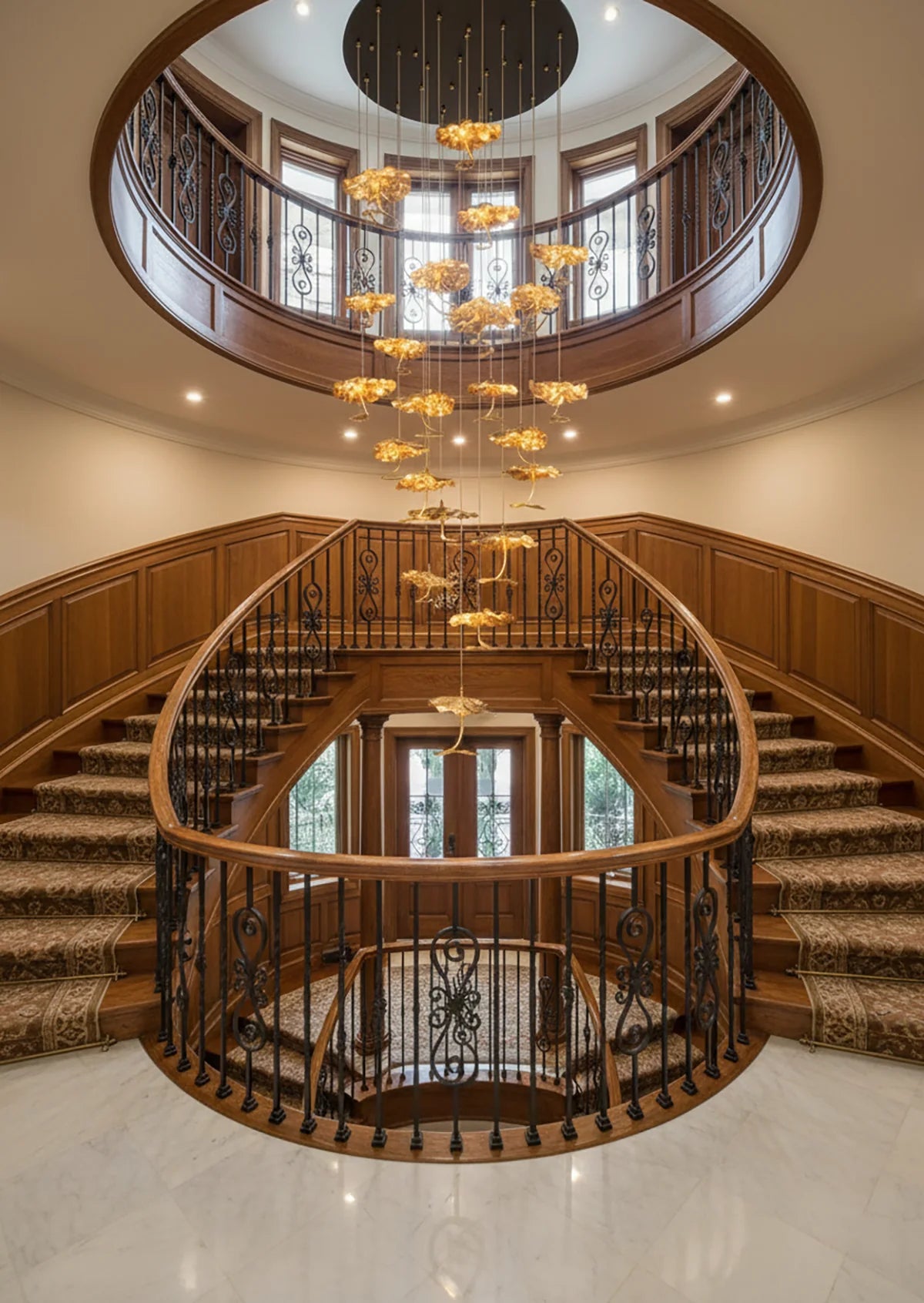 Brass aviary constellation chandelier with star-shaped accents and intricate metalwork, hanging with multiple light bulbs.