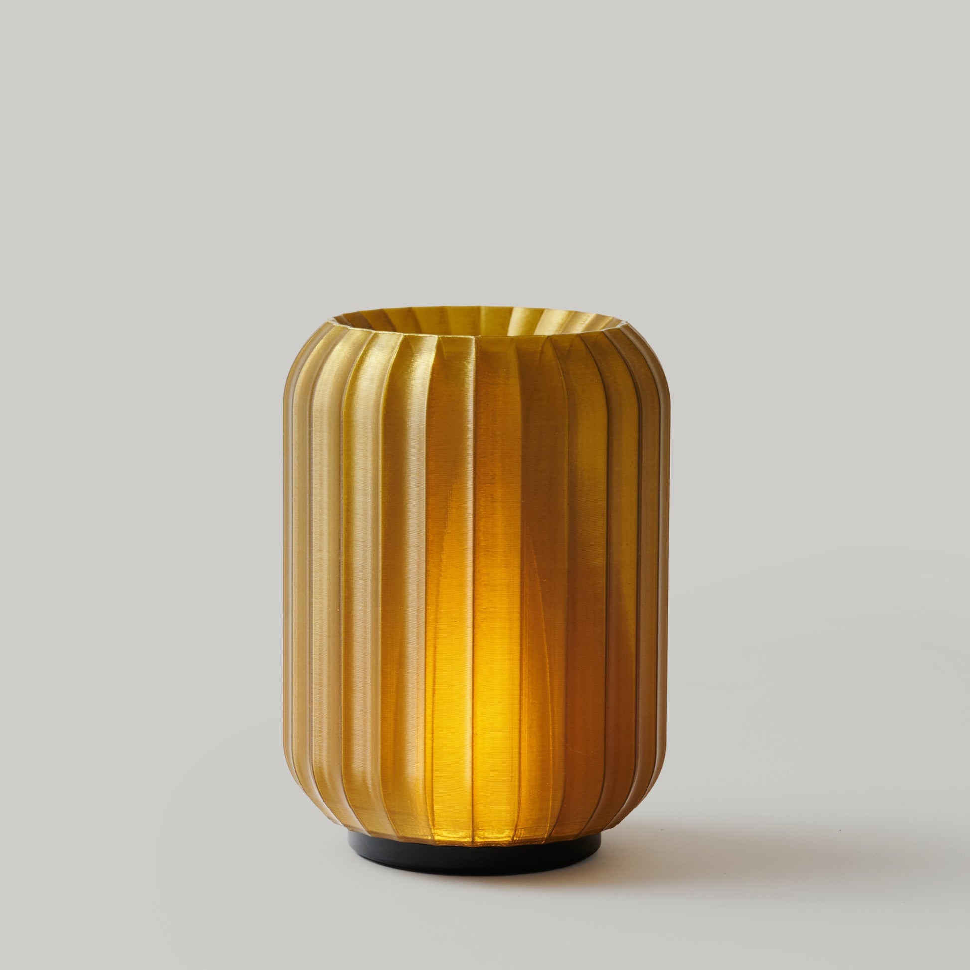 Wooj Design Cordless Mini Allium Lamp in green with a sleek, modern design and compact shape, suitable for ambient lighting.