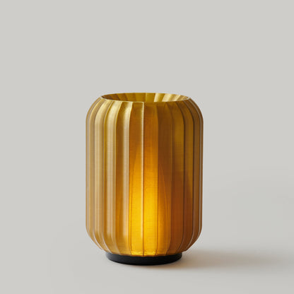 Wooj Design Cordless Mini Allium Lamp in green with a sleek, modern design and compact shape, suitable for ambient lighting.