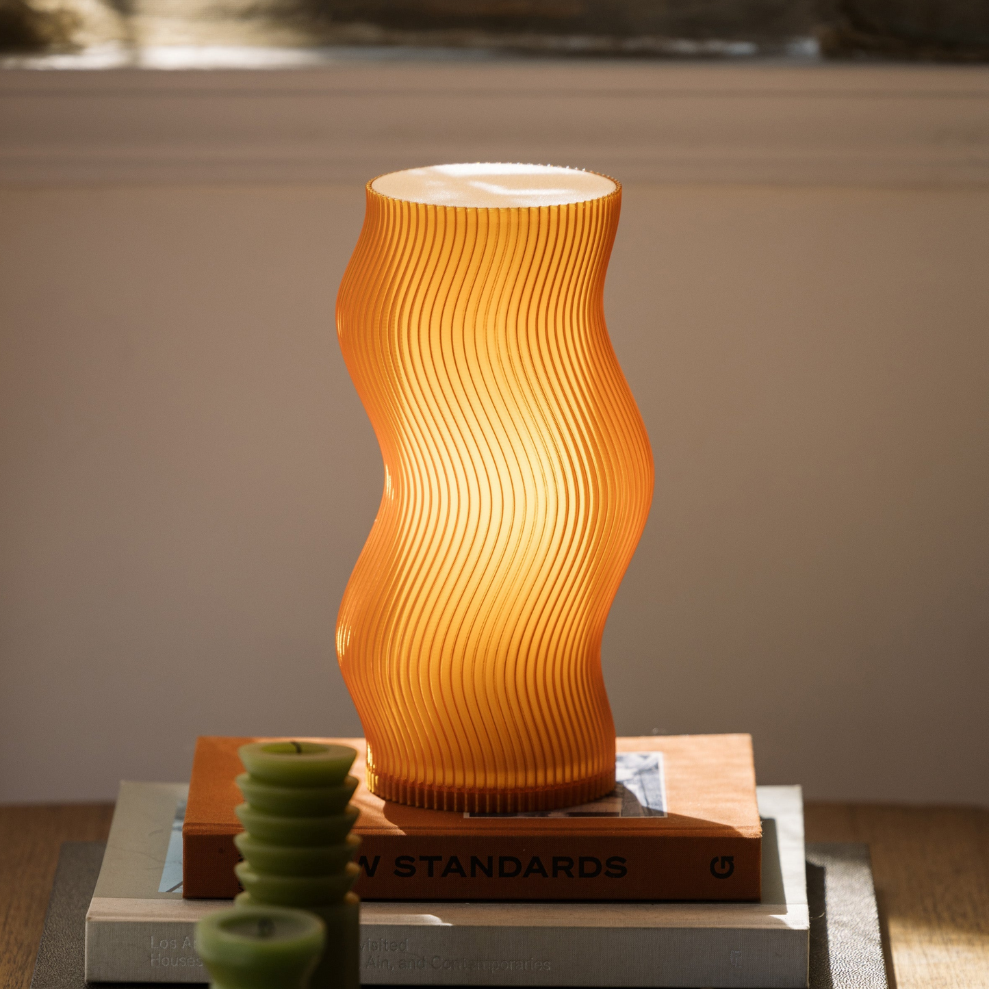 Terra Labs Woogie Table Lamp with colorful, whimsical design, featuring a rounded base and soft glowing light for cozy ambiance.