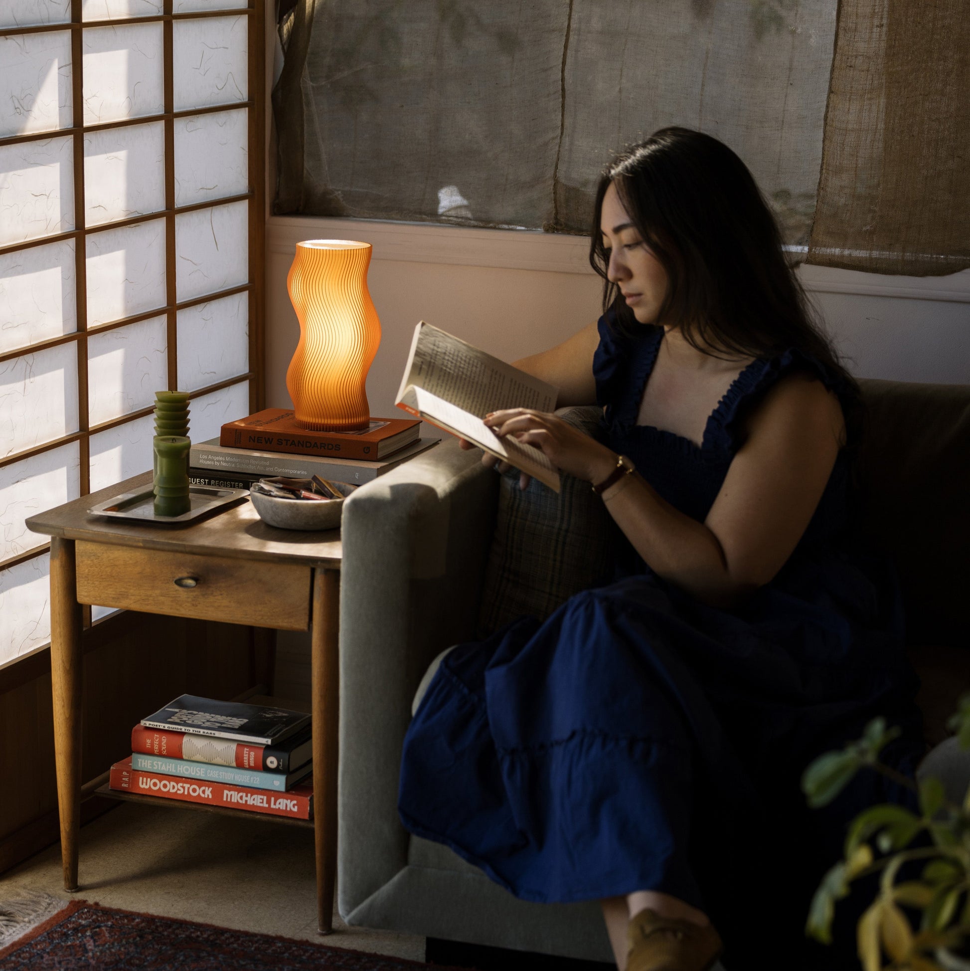 Terra Labs Woogie Table Lamp with organic-shaped ceramic base and fabric shade, ideal for modern living room or bedroom decor.