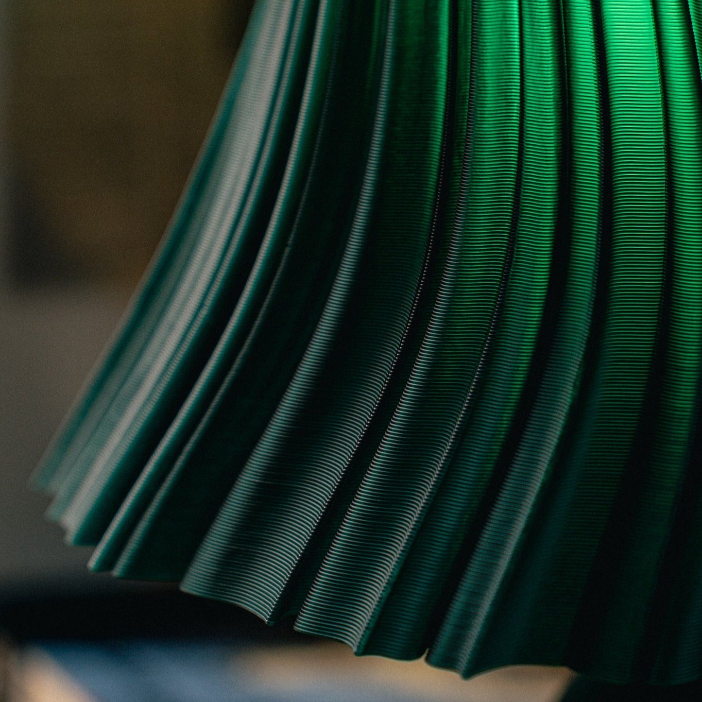 Wooj Design Pleat Lamp with a fabric shade and sleek base, modern table lamp for stylish home lighting.