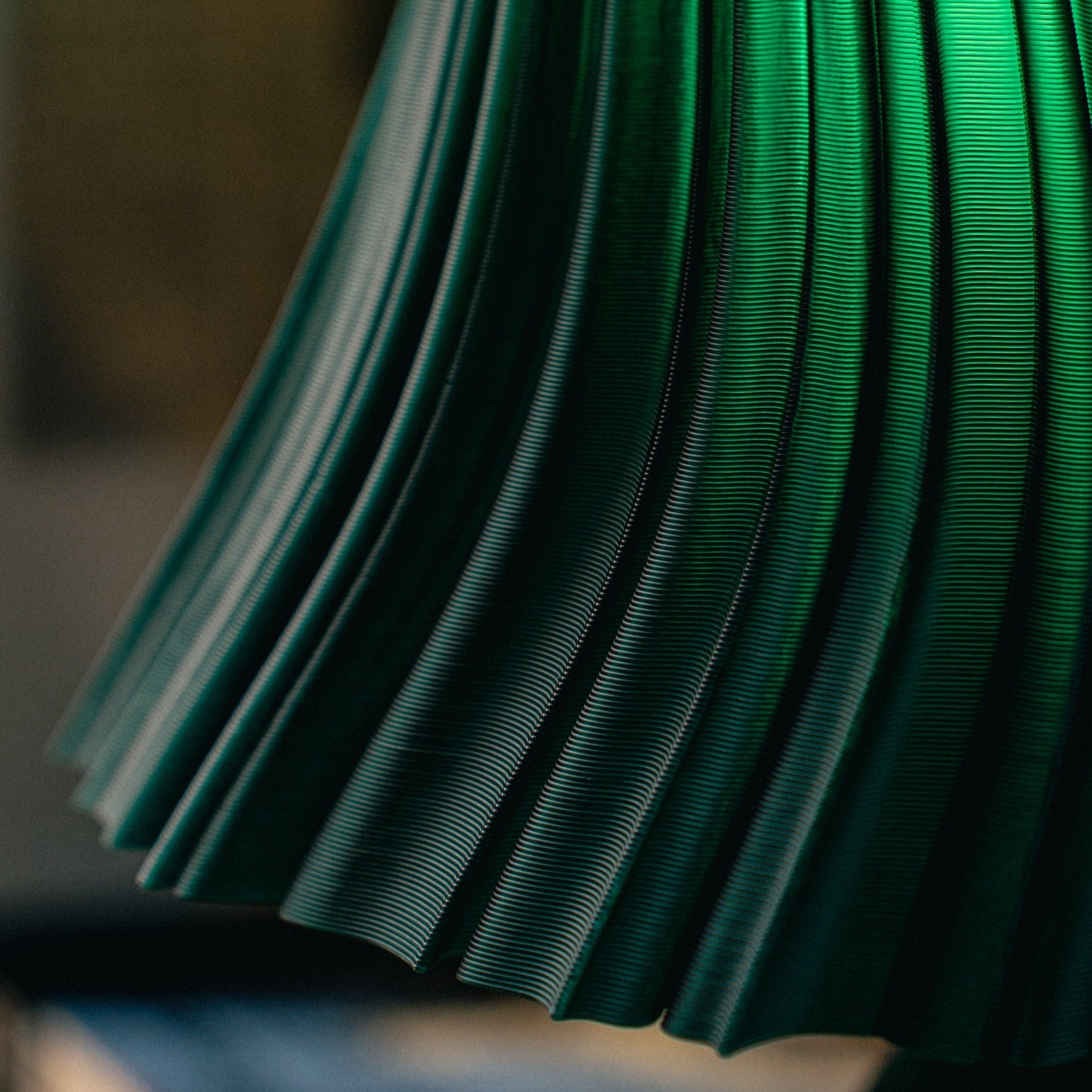 Wooj Design Pleat Lamp with a fabric shade and sleek base, modern table lamp for stylish home lighting.
