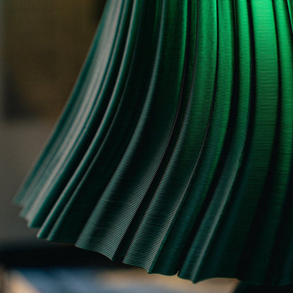 Wooj Design Pleat Lamp with a fabric shade and sleek base, modern table lamp for stylish home lighting.