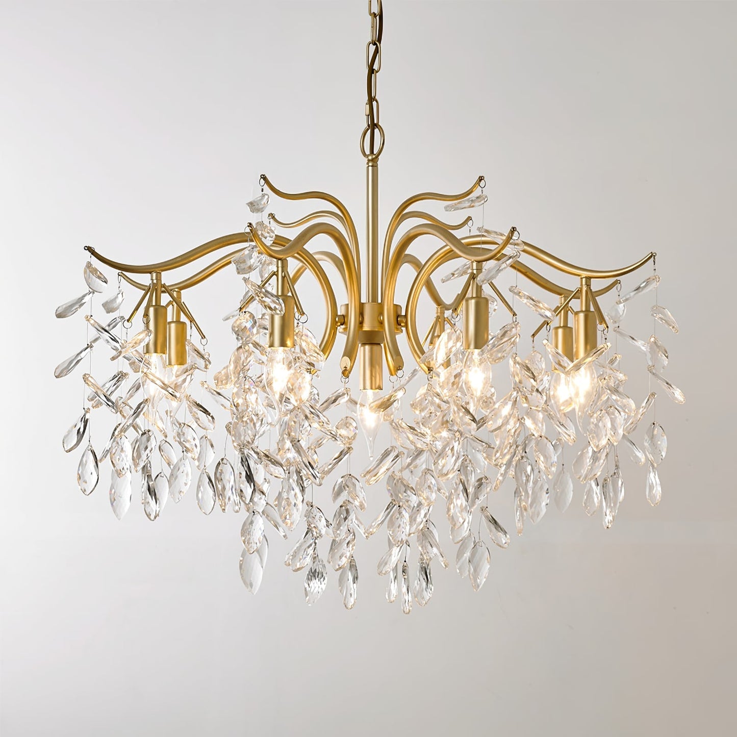 Dorale chandelier by Korewolamp featuring intricate metalwork and multiple hanging glass orbs for elegant interior lighting.