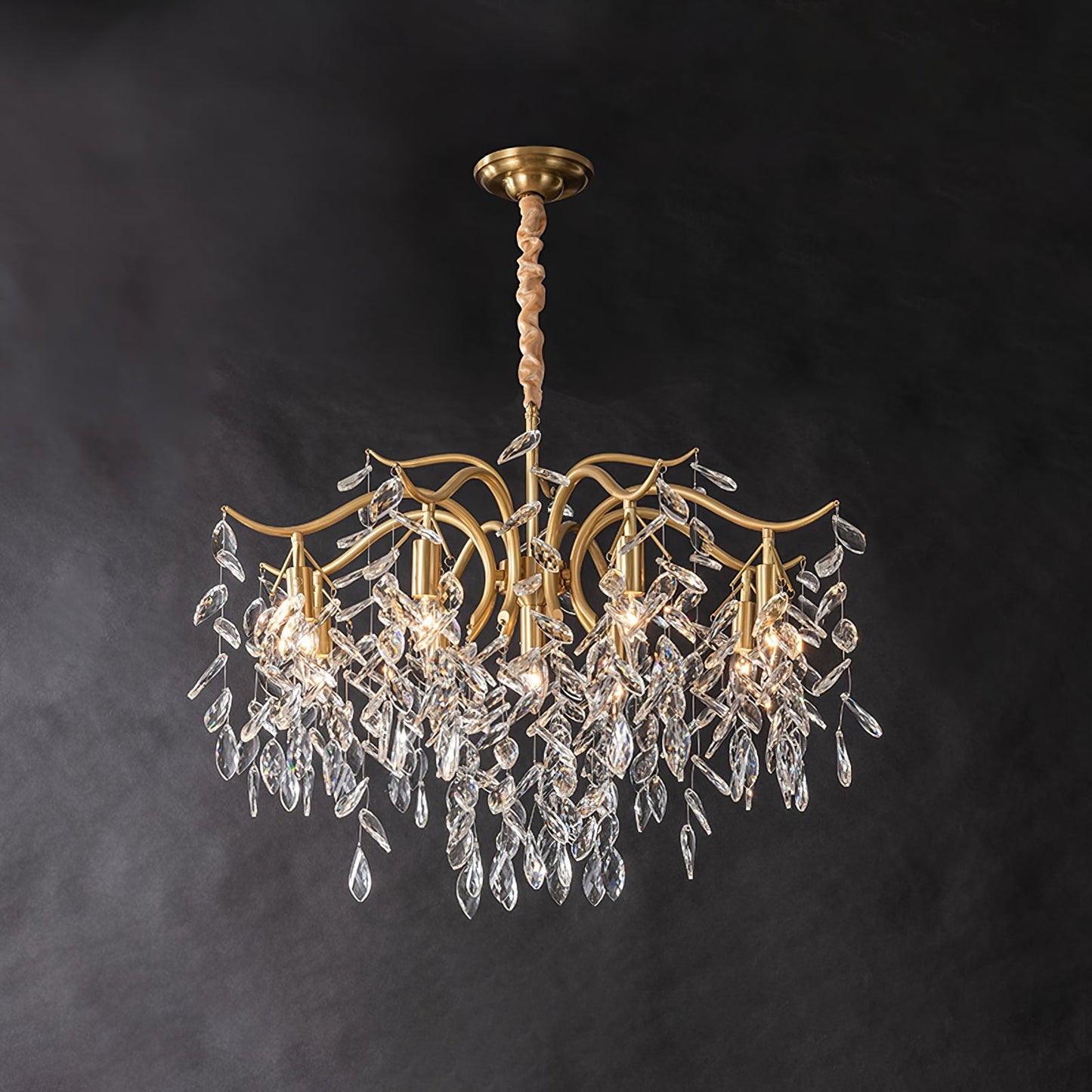 Dorale chandelier by Korewolamp featuring elegant cascading design with multiple light bulbs and intricate metal detailing.