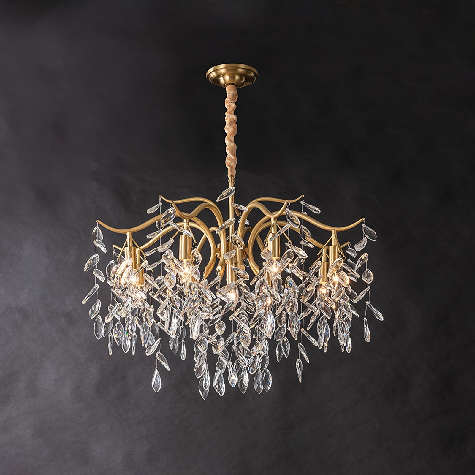 Dorale chandelier by Korewolamp featuring elegant cascading design with multiple light bulbs and intricate metal detailing.
