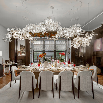 Korewolamp Gingko Ceramic Chandelier K with ginkgo leaf-shaped design, hanging from a metal chain with warm lighting.
