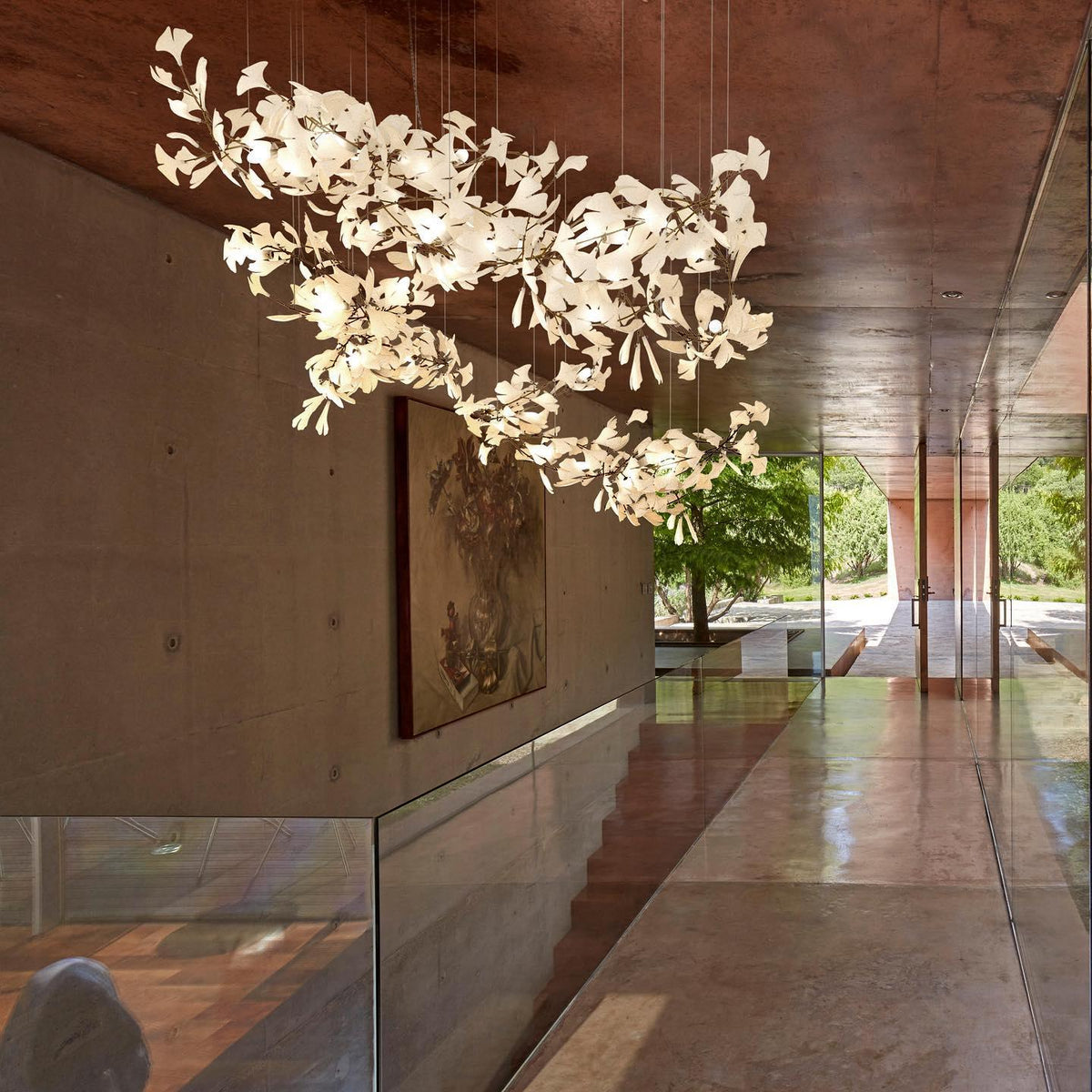 Korewolamp Gingko ceramic chandelier with ginkgo leaf design and multiple light fixtures hanging from a sleek frame.