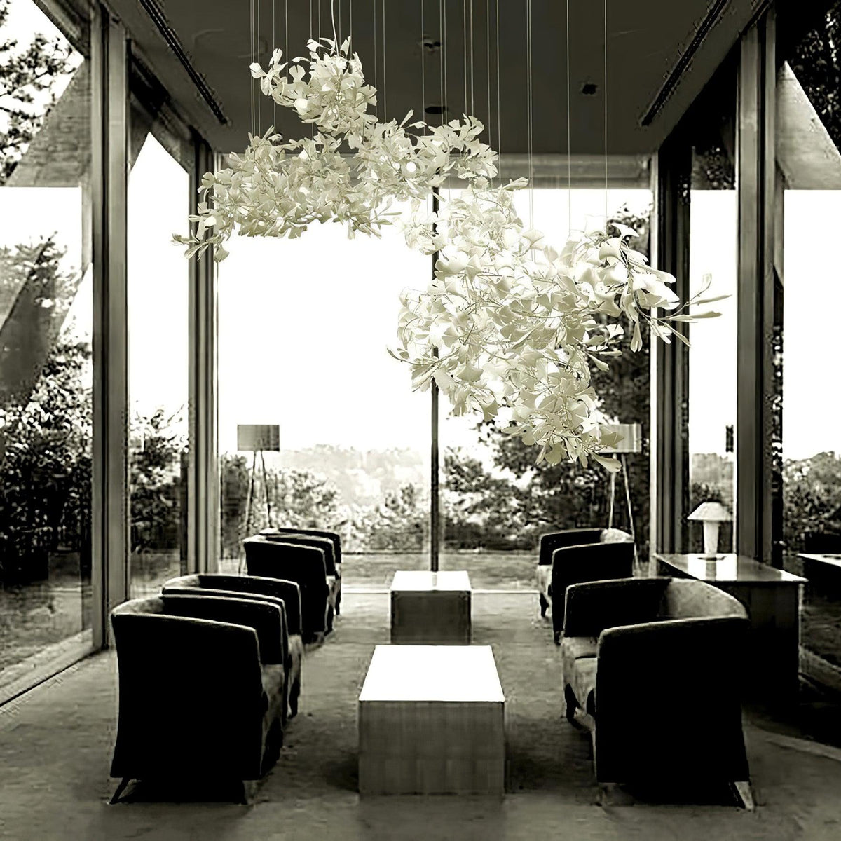 Korewolamp Gingko Ceramic Chandelier with multiple ginkgo leaf-shaped light fixtures hanging from a sleek metal frame.