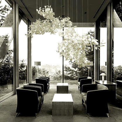 Korewolamp Gingko Ceramic Chandelier with multiple ginkgo leaf-shaped light fixtures hanging from a sleek metal frame.