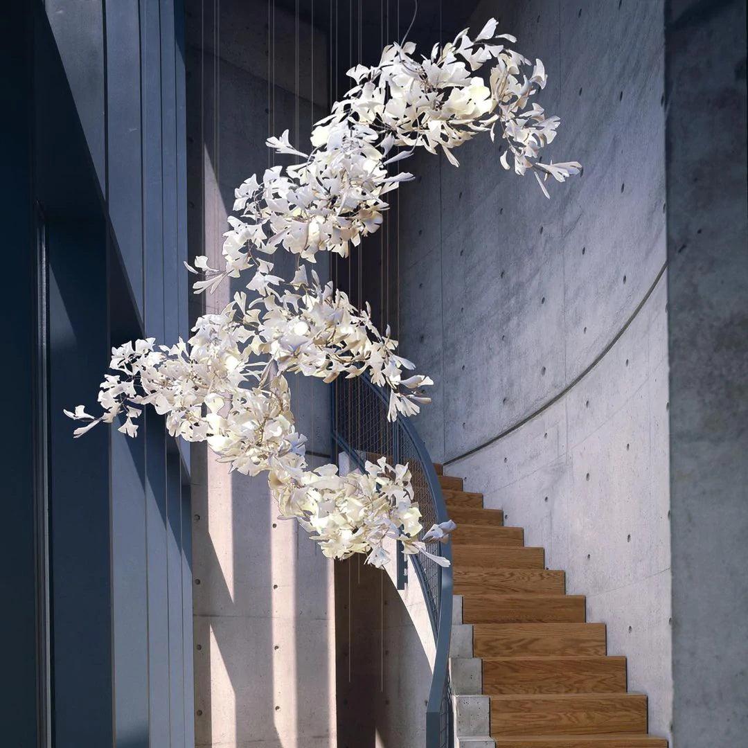 Korewolamp Gingko Ceramic Chandelier C hanging with multiple Ginkgo leaf-shaped ceramic shades in a modern design.