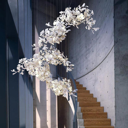 Korewolamp Gingko Ceramic Chandelier C hanging with multiple Ginkgo leaf-shaped ceramic shades in a modern design.
